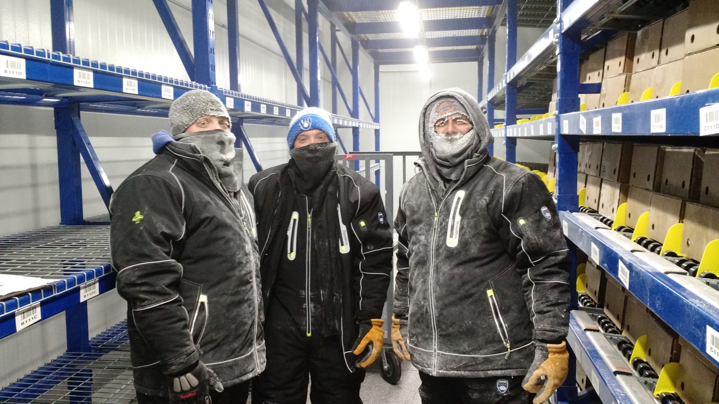 CSW employees bundled up in ultra-cold freezer